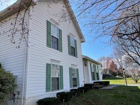 When does exterior cleaning start protecting more than just curb appeal